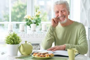 older man smiling with dental implants